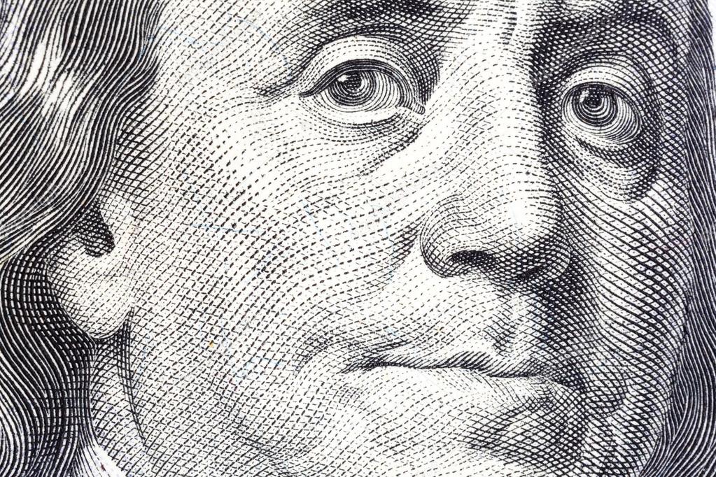 Portrait of Benjamin Franklin on one hundred dollar bill close-u