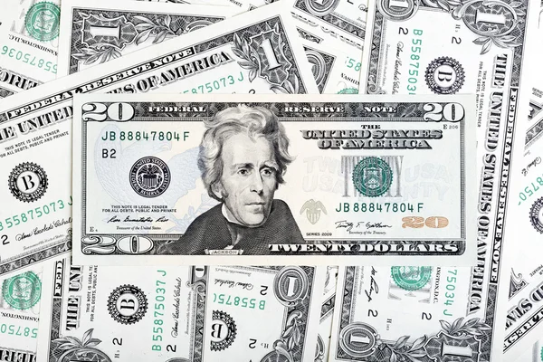 One dollar banknotes and twenty dollar bill close-up shot. — Stock Photo, Image