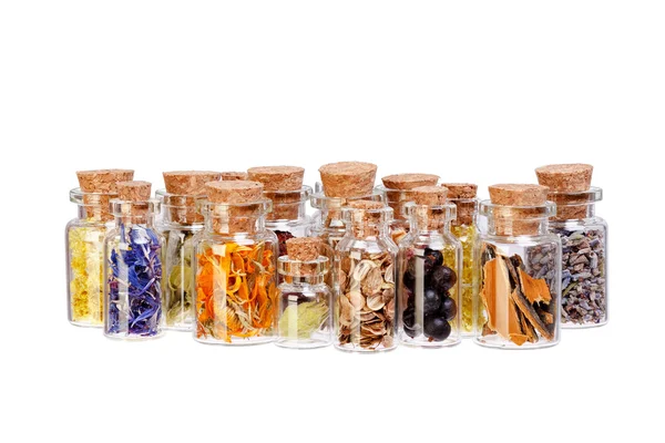 Herbal tea, dried herbs, flowers and berries in glass bottles fo — Stock Photo, Image