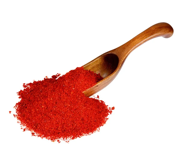 Powdered pimienta roja red pepper in the wooden spoon, isolated — ストック写真