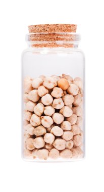 Chickpea in a glass bottle with cork stopper, isolated on white.