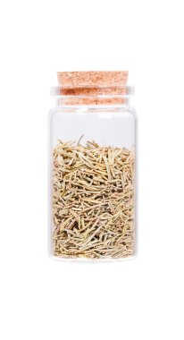Rosemary spice herb in a glass bottle with cork stopper, isolate