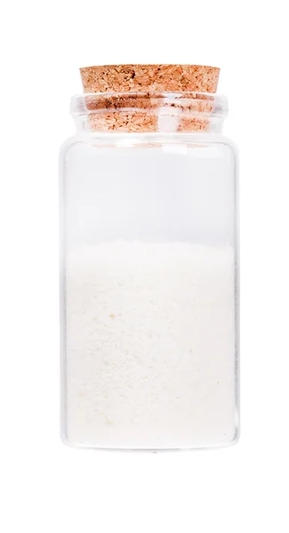 Кокос в скляній пляшці з пробкою пробкою, ізольований на білому . — стокове фото