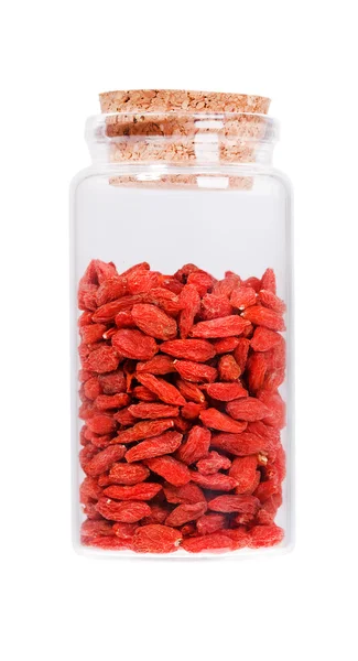 Dried goji berries in a glass bottle with cork stopper, isolated — Stock Photo, Image