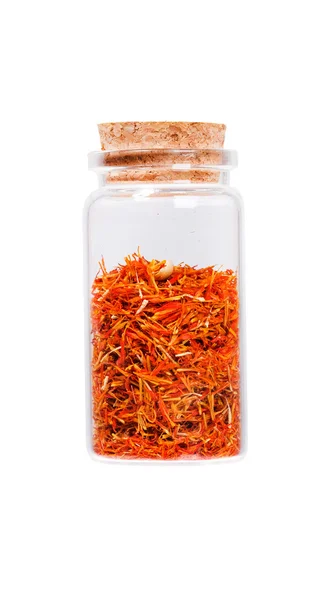 Saffron stamens in a glass bottle with cork stopper, isolated on — Stock Photo, Image