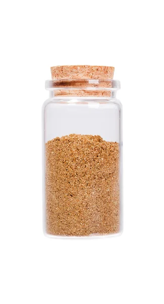 Raw organic coriander spice powder in a glass bottle with cork s — Zdjęcie stockowe