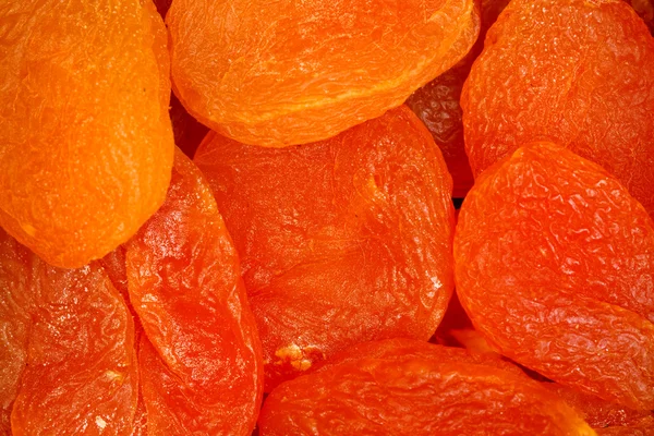 Dried apricot fruit forming a background. — Stock Photo, Image