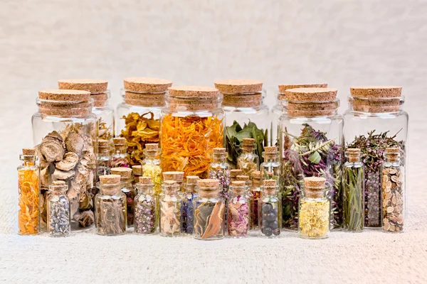 Bottles with herbs used in non- traditional medicine. — Stock Photo, Image