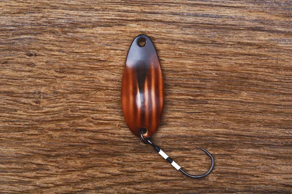 Handmade fishing lure on the old wooden table. — Stock Photo, Image