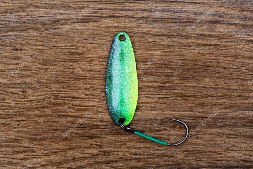 Fishing lure on the old wooden table. — Stock Photo © yamabikay #84404498