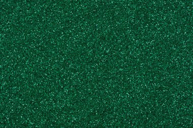 Koyu renk parlak desenli, Noel tasarımı için yeşil tonlu zarif bir arka plan. Yüksek çözünürlüklü fotoğraf.