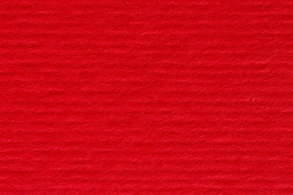 Parlak kırmızı soyulmuş kağıt arka plan. Yüksek çözünürlüklü fotoğraf.
