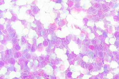 Enfes bir Noel dokusu, yüzeyinde ışıltılar olan yeni bir ışık arkaplanı. Yüksek çözünürlüklü fotoğraf.