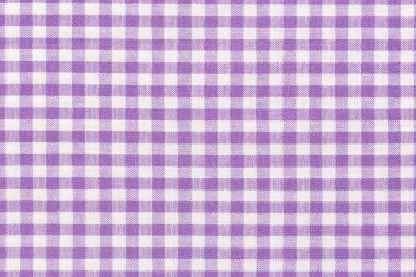 Mor denetlenmiş kumaş arkaplan kavramı.