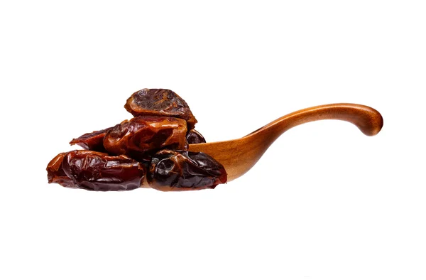 Dates in the wooden spoon, isolated on white background. — Stock Photo, Image
