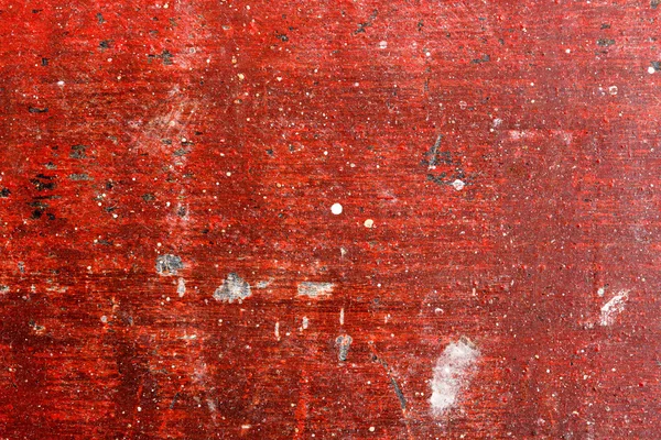 Rosso dipinto sfondo bordo di legno graffiato, texture . — Foto Stock