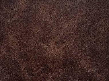 Luxury brown, leather textured surface. Genuine quality empty pattern in dark red tone. Eco rough background. Backdrop blank skin effect for design, upholstered furniture, purses, quality clothes
