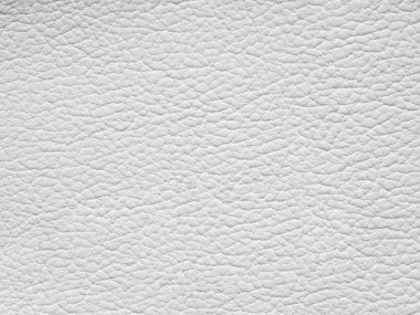 Beyaz deri örneği. Fotokopi alanı ve üst görünümü olan arkaplan. Açık beyaz tonda hakiki deri dokusu. Tasarım için arka plan desenli efekt, döşenmiş mobilya, giysi. Sahte eko deri..