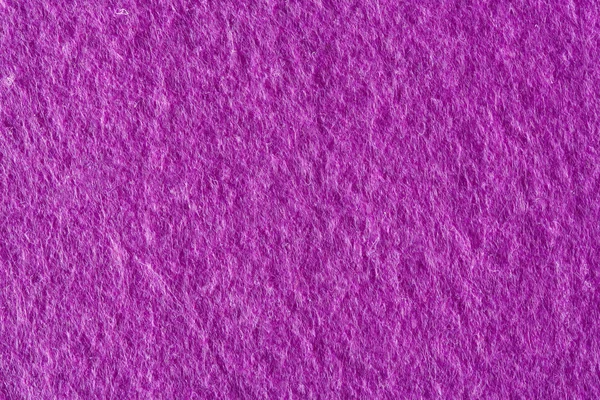 Eine Nahaufnahme von lila Filzstoff Hintergrund. — Stockfoto