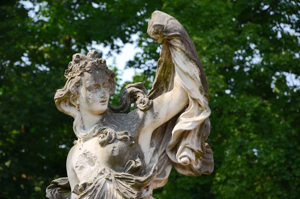 Old sculpture in park — Stock Photo, Image