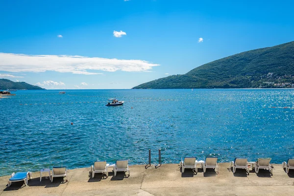Harbor and beach in sunny day at Boka Kotor bay (Boka Kotorska), Montenegro, Europe. — Stock Photo, Image