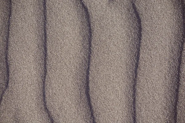 Closeup vzorku sopečného písku Beach v létě - s červeným odstínem — Stock fotografie