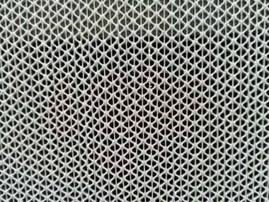 Örgü desenli bir yüzeye yakın çekim. Kalıp birçok küçük kareden oluşur.