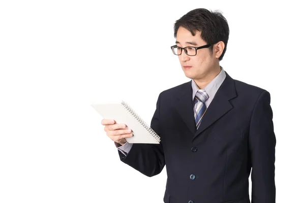 Asiatiska affärsman läsa notebook eller dagbok för att kontrollera, isolat — Stockfoto
