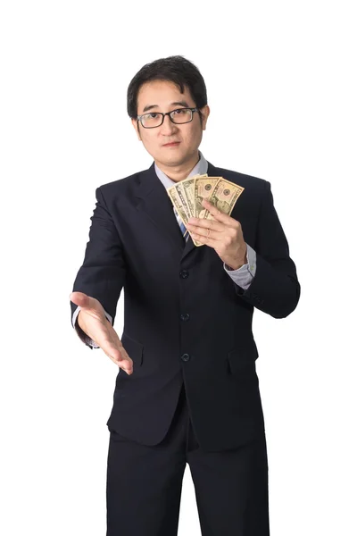 Успешный азиатский бизнесмен держит в руках долларовые деньги и пожимает руки — стоковое фото