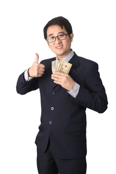 Успешный азиатский бизнесмен держит в руках долларовые деньги и делает большой палец — стоковое фото