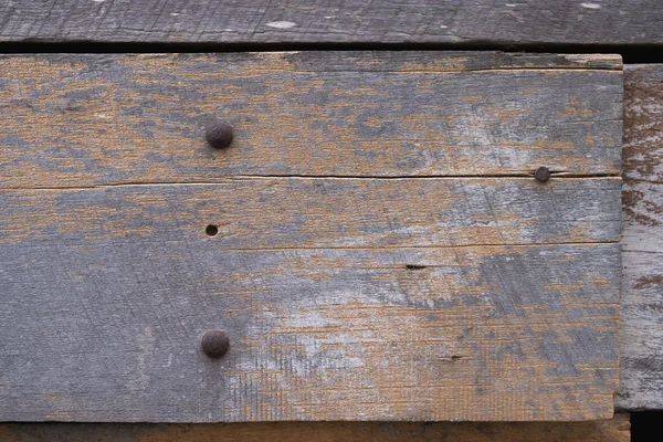 Closeup of old grunge wood with rusty screw background — Stock Photo, Image