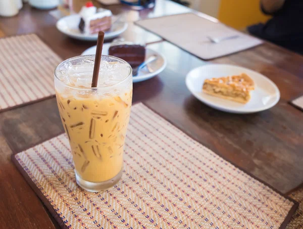 Iced coffee with milk is on the mat — Stock Photo, Image