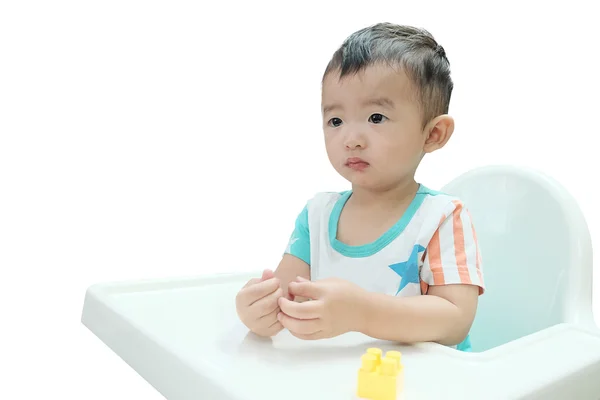 Bebé asiático hambriento en la silla alta. Niño esperando por comida, aislado — Foto de Stock