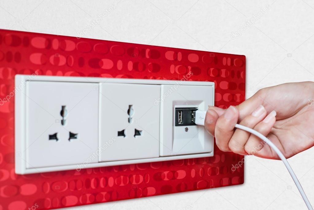 Woman hand plug USB Wall socket outlet plate