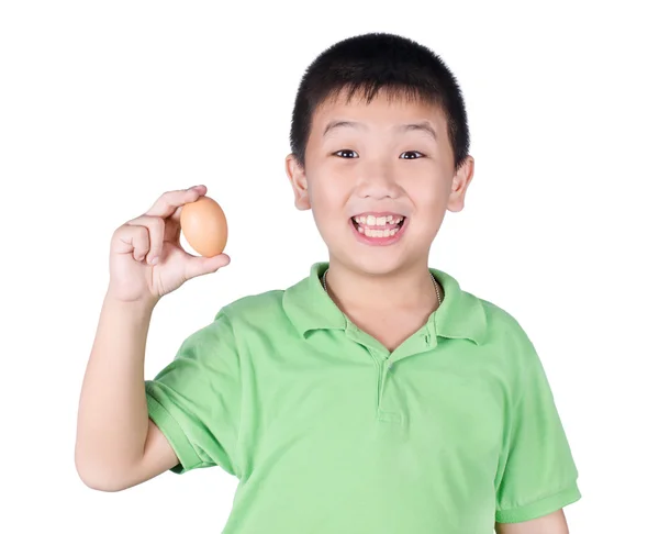 Boy holding hen egg in hand on white background isolated. — Stock Photo, Image