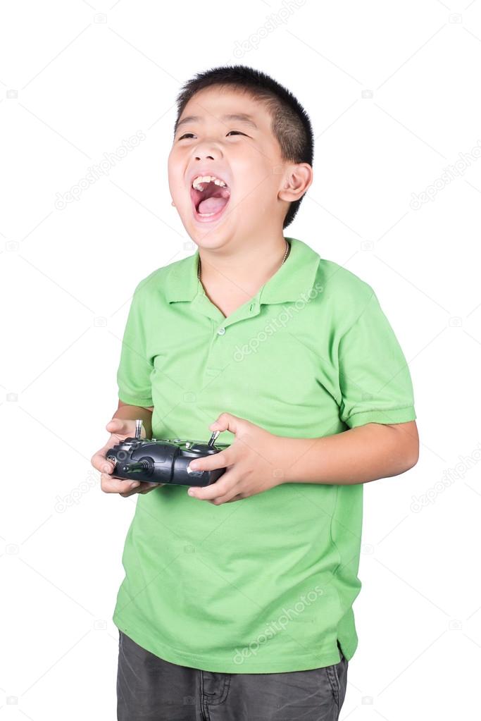 Little boy holding a radio remote control (controlling handset) for helicopter , drone or plane Isolated on white background