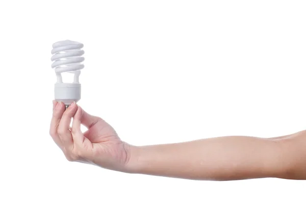 Hand med energibesparande lampa på vit bakgrund — Stockfoto