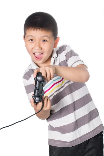 Asian boy with a joystick playing video games, isolated on white background — Stock Photo, Image