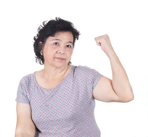 Strong Asian senior female showing off her biceps flexing muscle — Stock Photo, Image