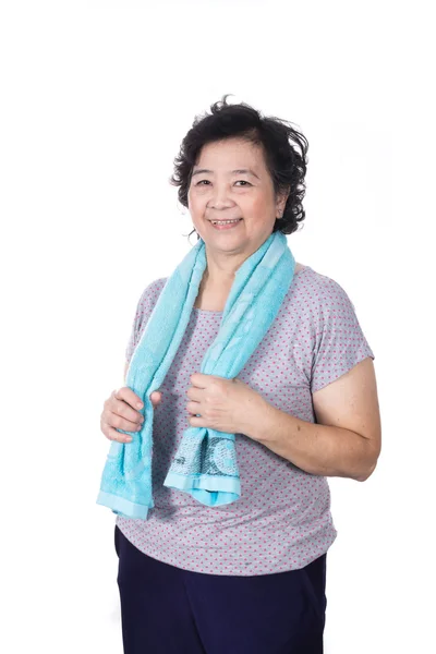 Old Asian woman smiling after workout, holding towel around neck — Stock Photo, Image