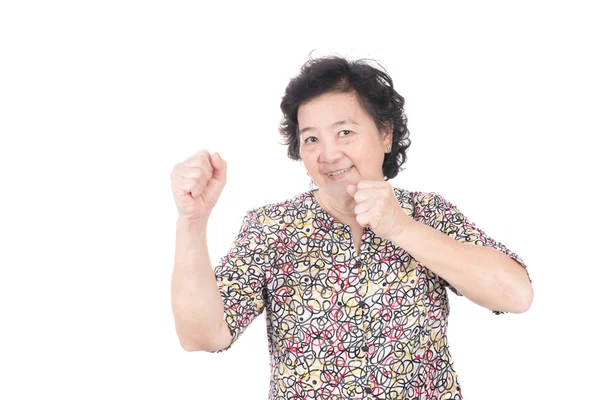 Asian old woman giving punch over isolated white background — Stock Photo, Image