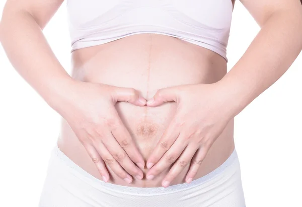 Pareja cariñosa con las manos alrededor del vientre embarazada —  Fotos de Stock