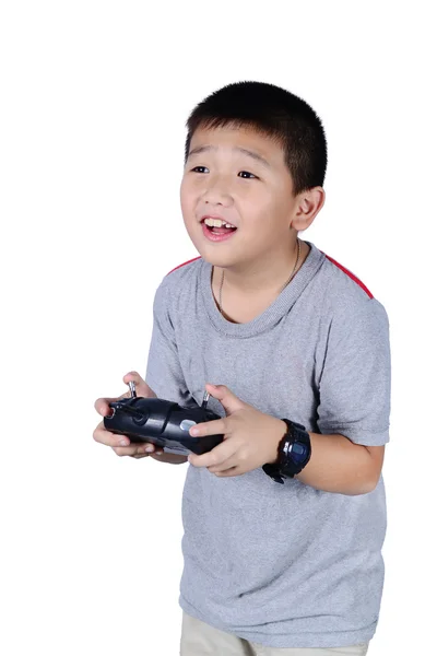 Pequeño niño sosteniendo un control remoto de radio para helicóptero, dron —  Fotos de Stock