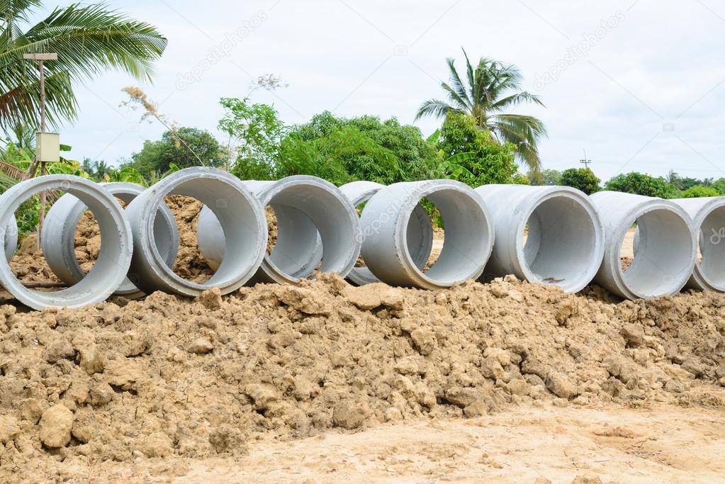 Concrete drainage pipes stacked for construction, irrigation, in