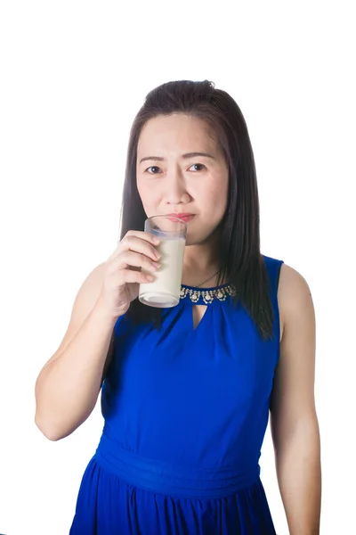 Happy Asian woman with glass of milk in hand isolated on white b — Stock Photo, Image