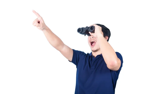 Asian guy holding binoculars, isolated on a white background. Stock Photo