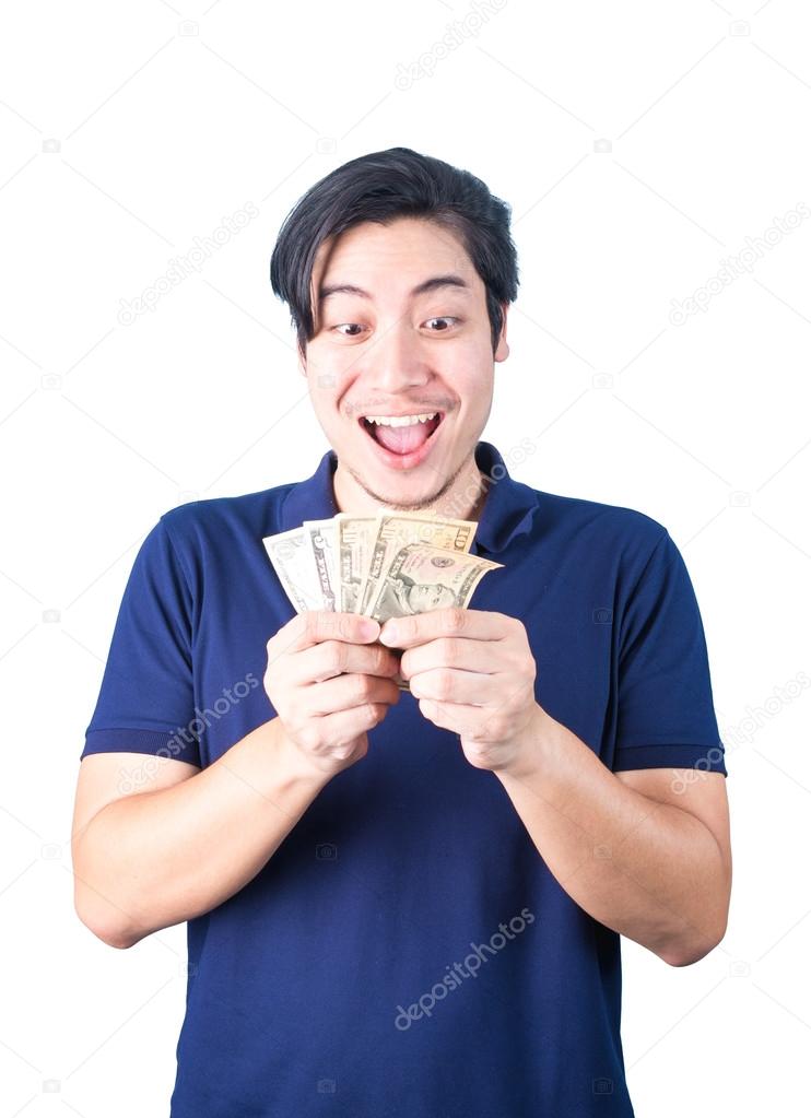 Asian handsome man holding money while standing isolated on whit