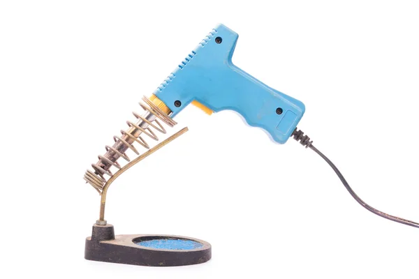 Old rusty blue soldering iron standing on the holder, isolated o — Stock Photo, Image