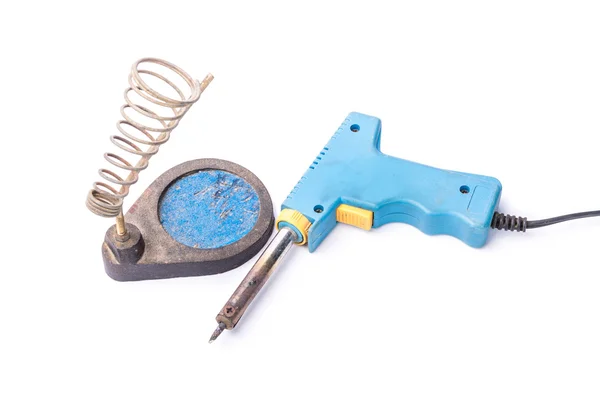 Old rusty blue soldering iron standing on the holder, isolated o — Stock Photo, Image