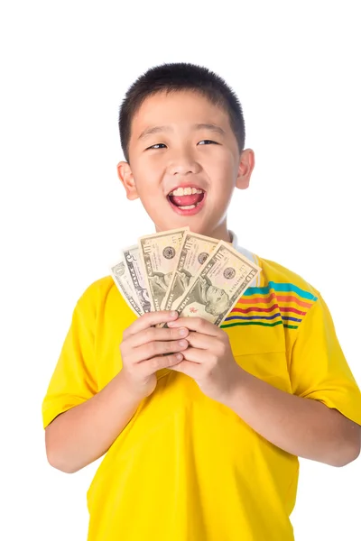 Asian child holding money while standing isolated on white backg — Stock Photo, Image